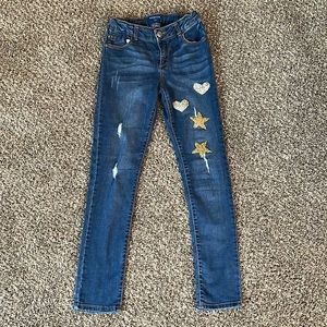 Girl size 12 Arizona jeans 👖inside adjustable waist strap’s.